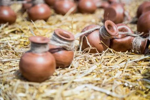 Small ceramic crocks or pot on straw Stock Photos