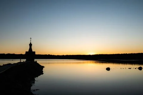 A small chapel in the background of the sunset. Stock Photos