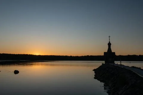 A small chapel in the background of the sunset. Stock Photos