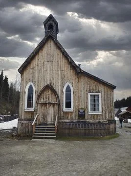 A small chapel with clouds above Stock Photos
