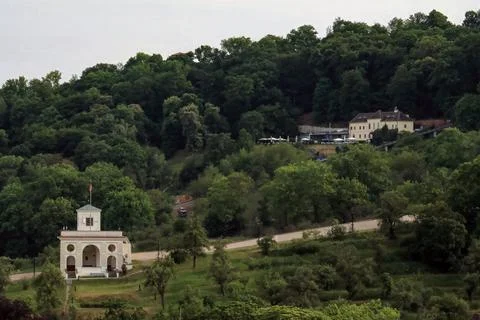 Small chapel on a green hillside Stock Photos