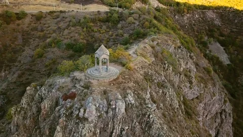 A small chapel on the mountain edge against at the morning. Aerial shot Stock Footage 81637454