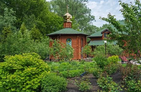 Small chapel surrounded by green vegetation Stock Photos