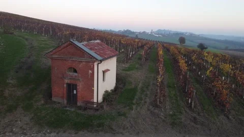 Small chapel surrounded by plowed fields and vineyards in Monferrato Видео 150969580