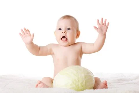Small child and a cabbage Stock Photos