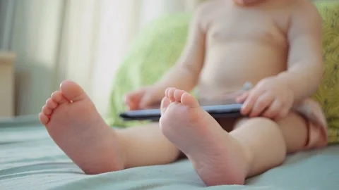 Small child and modern technology. sitting child with electronic tablet Stock-Footage 146346877