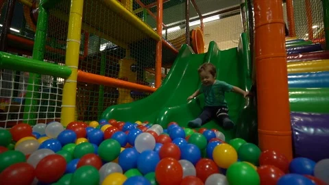 A small child / boy dressed in a turquoise t-shirt Stock Footage 104028259