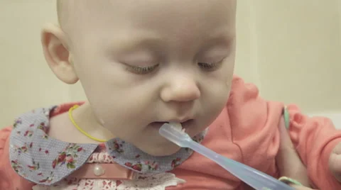 Small child brushes his teeth in the bathroom Stock Footage 62393636