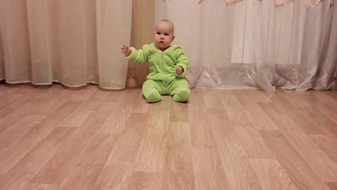 Small child crawls on the floor Stock Footage 83877759