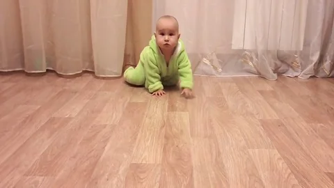 Small child crawls on the floor Stock Footage 83877796