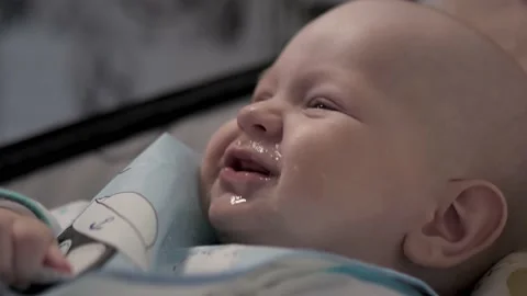 A small child does not want to eat with a spoon.Baby.Baby.Close - up of the face Видео 169703391