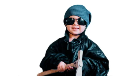 A small Child dressed as a Bully with a Hammer threatens people. Stock Footage 88501714