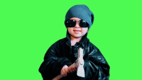 A small Child dressed as a Bully with a Hammer threatens people. Stock Footage 88501717