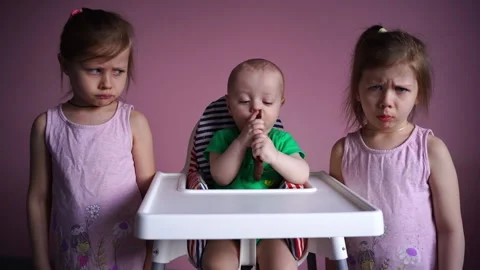 A small child eats chocolate. The kid is happy. Stock Footage 169158817