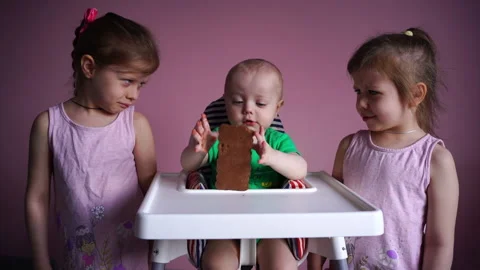 A small child eats chocolate. The kid is happy. Stock Footage 169158866