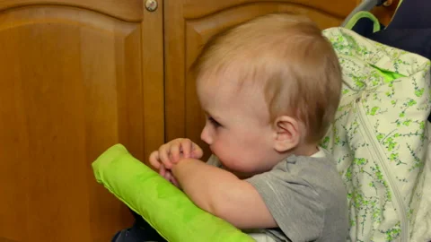 A small child is fed from a spoon Stock Footage 86597462