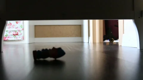 Small child with a flashlight looking under the bed toy. Full HD. 1920x1080 Stock Footage 67333733