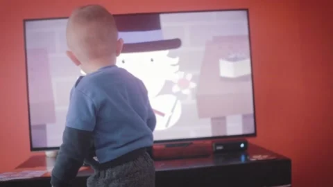 Small Child in Front of a TV Stock Footage 199660523