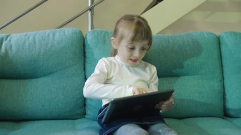 Small Child Hold Pad Computer Surfing Internet Play Game At Home Alone Stock Footage 170127476