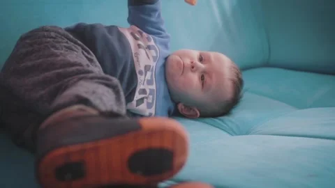 Small Child Lying and Eating Stock Footage 199659520