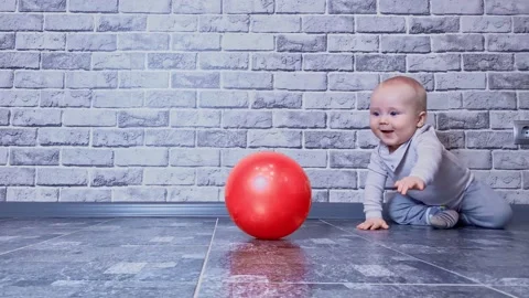 Small child playing with ball Stock Footage 180949958