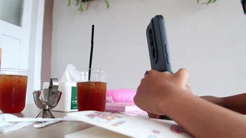 Small child playing handpone Stockbeeldmateriaal 244453097