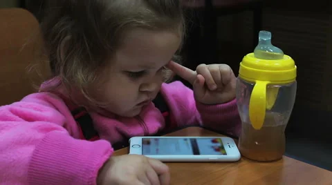 Small child playing with the phone Stock Footage 56529883