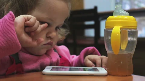 Small child playing with the phone Stock Footage 56530022