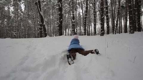 Small child playing in the snow Stock-Footage 70284307
