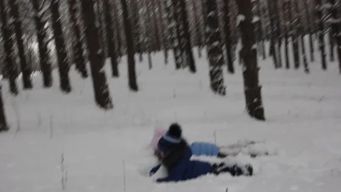 Small child playing in the snow Stock Footage 70284333