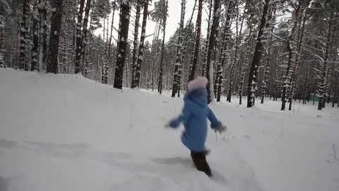 Small child playing in the snow Stock-Footage 70285552