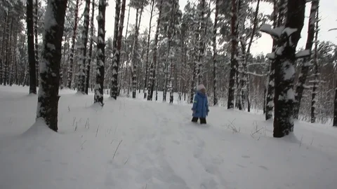 Small child playing in the snow Stock-Footage 70286167