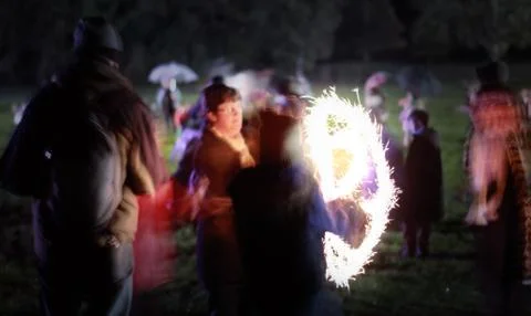 Small Child Playing With Sparkler on Firework Night - Light Trails Stock Photos
