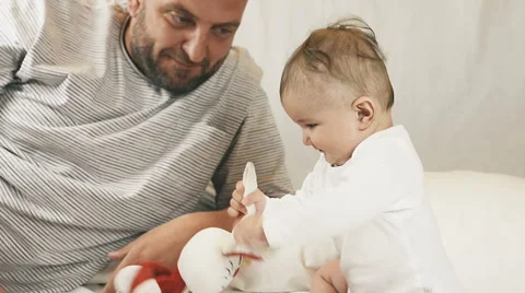 A small child playing successfully caught the rabbit, video Stockbeeldmateriaal 67443347