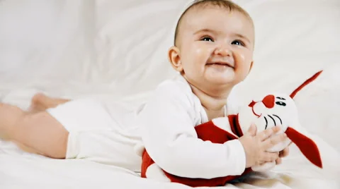 A small child playing successfully caught the rabbit, video Stockbeeldmateriaal 67443783