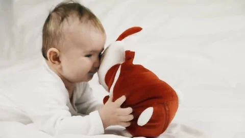 A small child playing successfully caught the rabbit, video Stockbeeldmateriaal 69218295