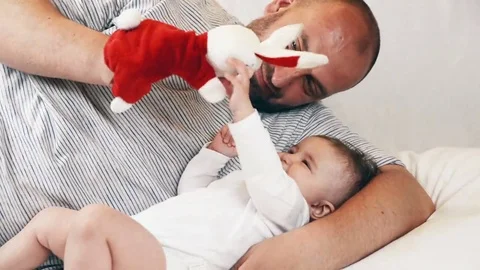 A small child playing successfully caught the rabbit, video Stockbeeldmateriaal 69218320