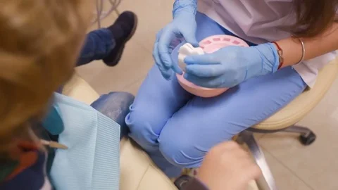 A small child plays with a dentist in a dentist's toy tools. Stock Footage 84785370