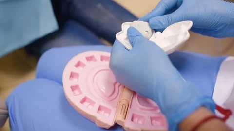 A small child plays with a dentist in a dentist's toy tools. Stock Footage 84785466