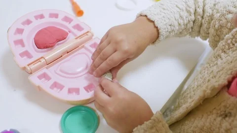 A small child plays with a dentist in a dentist's toy tools. Stock Footage 84787996
