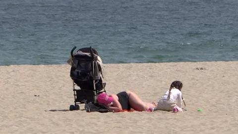 A small child Plays On Empty Beach. Video stock 130207210