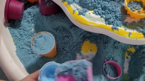 Small child plays with kinetic sand, the development of fine motor skills Stock Footage 243723480