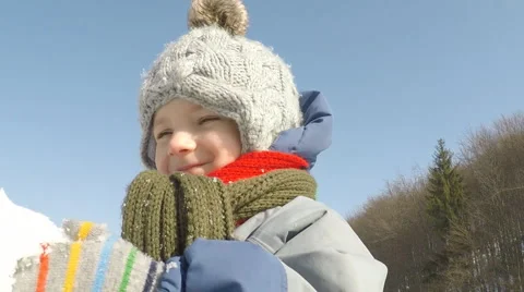 Small child plays with snow Video stock 47407474