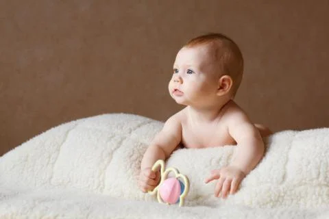 Small child with a rattle Stock Photos