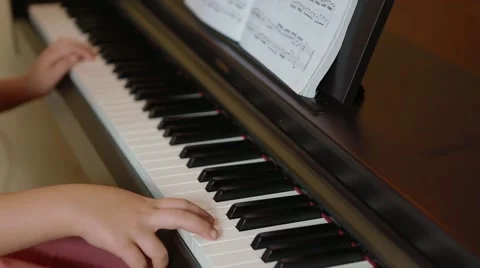 Small child singing piano Stock Footage 55751919