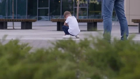 A small child sits lost in his thoughts. Video stock 294103600