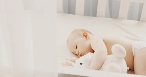 Small child sleeps at home in a crib Stock Footage 143403132
