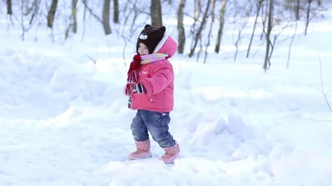 A small child in the snowy forest Stock Footage 72778840