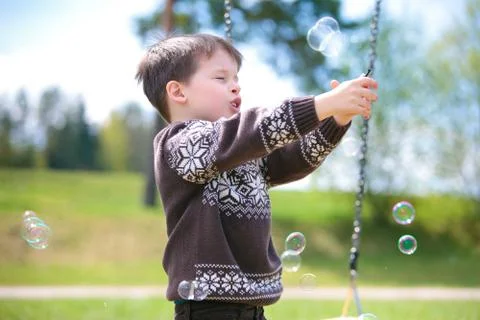 Small child on swing Stock Photos