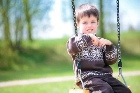 Small child on swing Stock Photos
